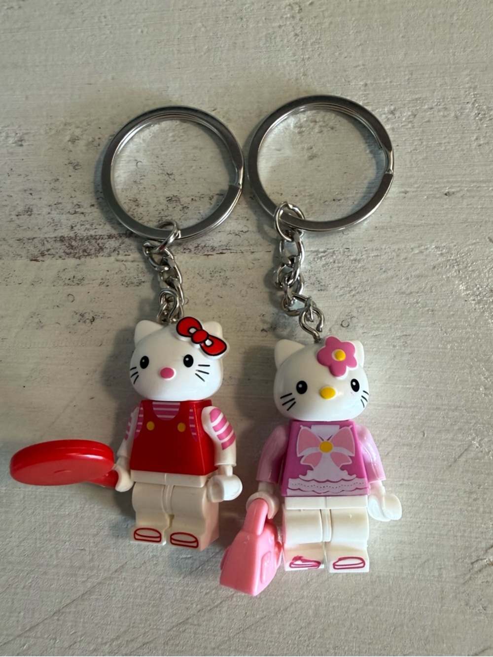 Hello Kitty Keychain Lot of 2 Pink Red Minifigure Style Figures Sanrio